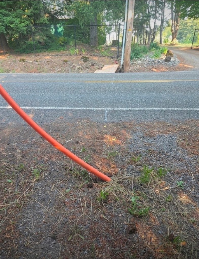 Orange conduit at road bore project